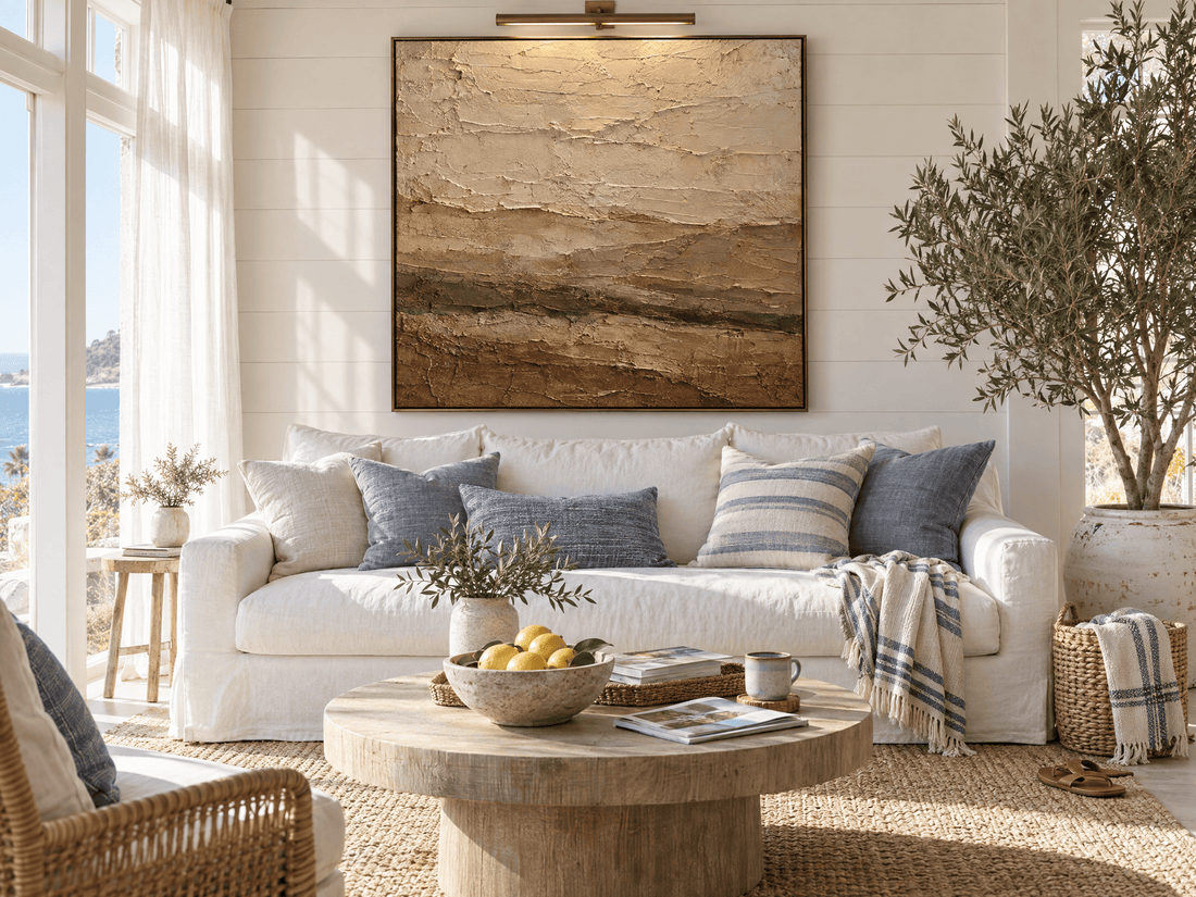 Oversized terracotta and cream abstract canvas in a bright coastal living room