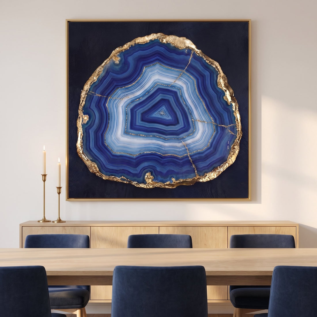 Blue agate canvas above an oak sideboard in a white dining room with navy chairs