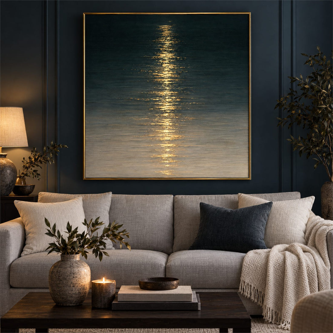 Navy and gold moonlit water canvas above a sofa on a dark panelled wall