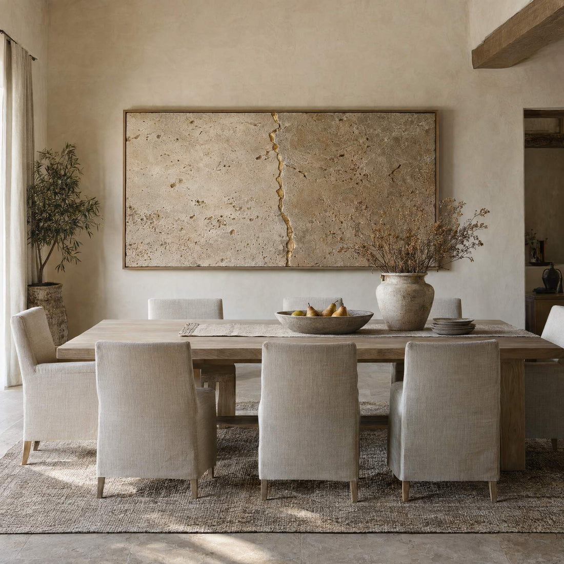 Cream travertine kintsugi canvas above a dining table