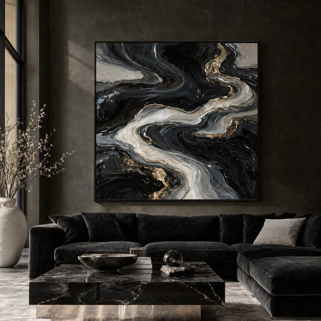 Black and silver abstract river canvas above a dark velvet sofa