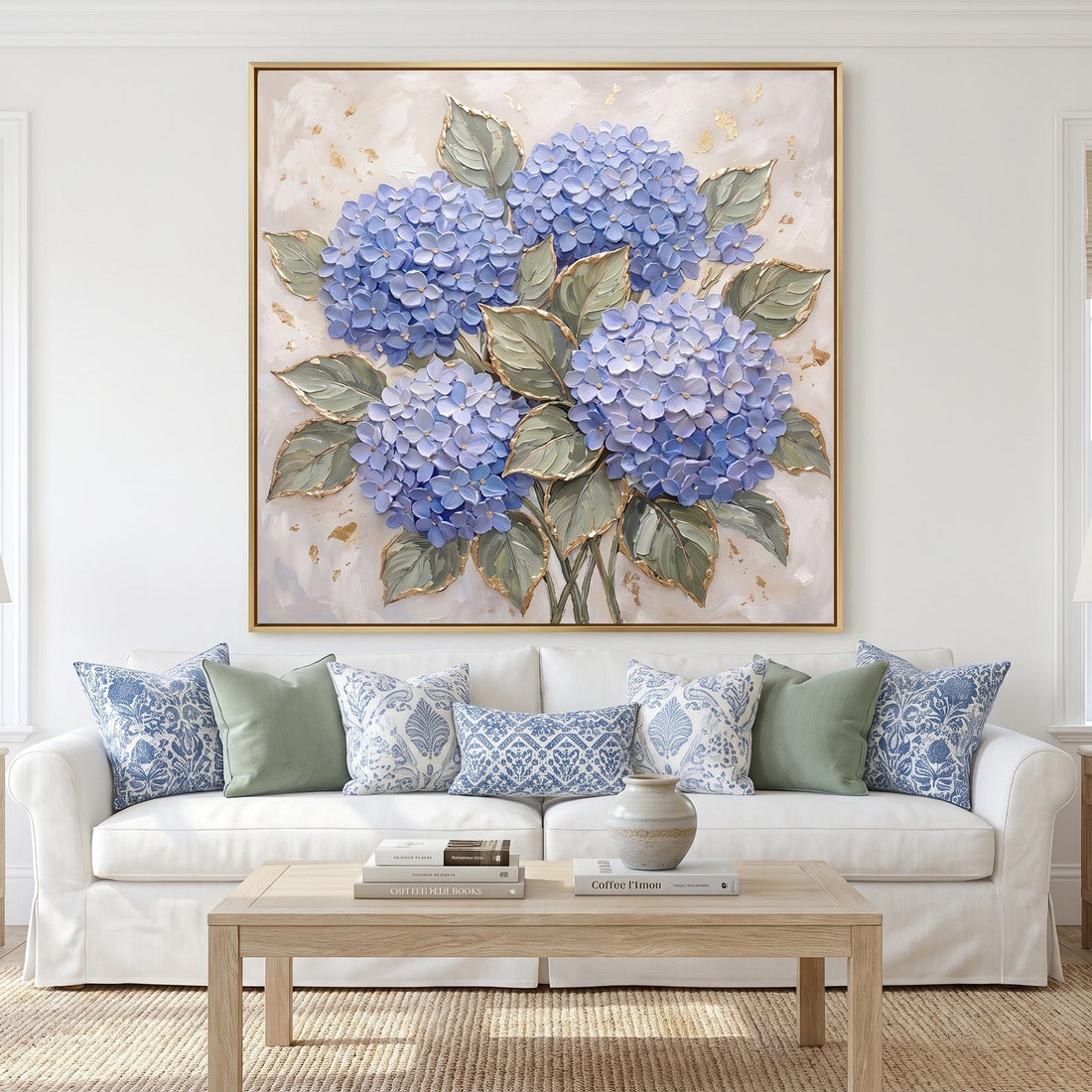 Blue hydrangea wall art with gold leaf above a white slipcovered sofa