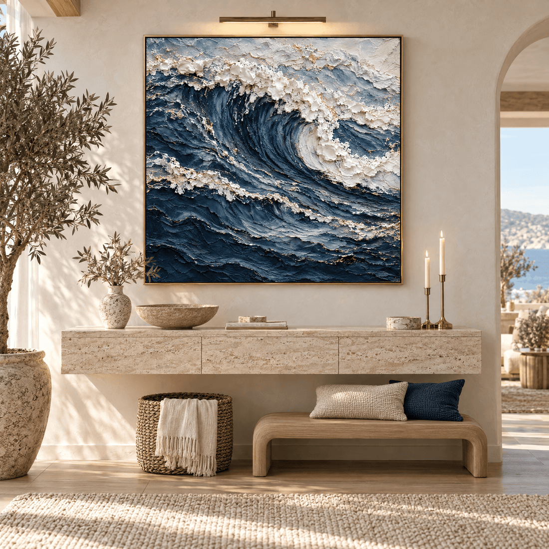 Ocean wave wall art above an entryway console in a warm neutral hallway
