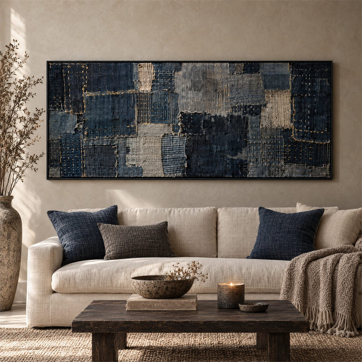 Panoramic indigo boro patchwork canvas above a linen sofa