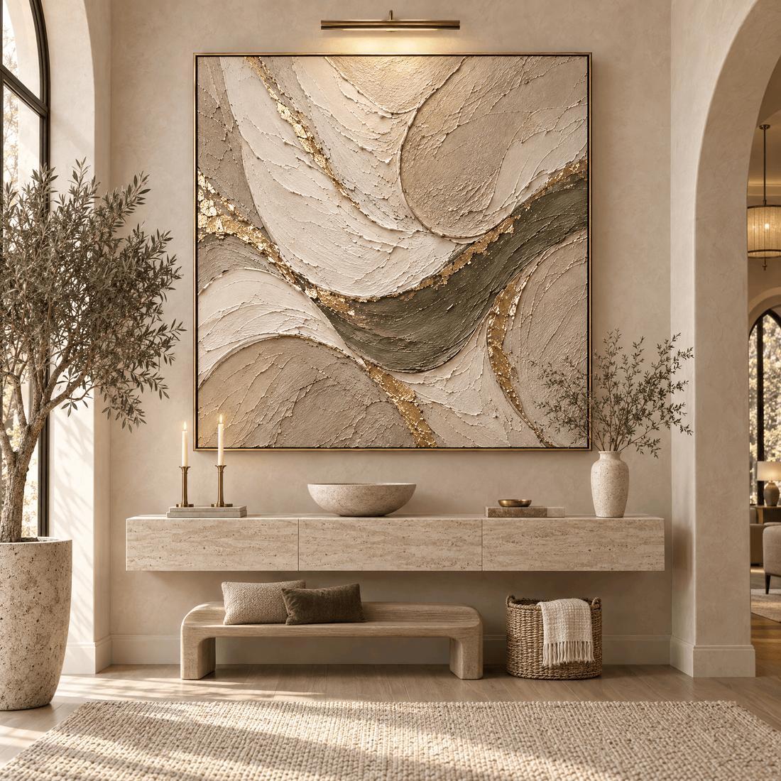 Gold leaf abstract canvas above a travertine entryway console