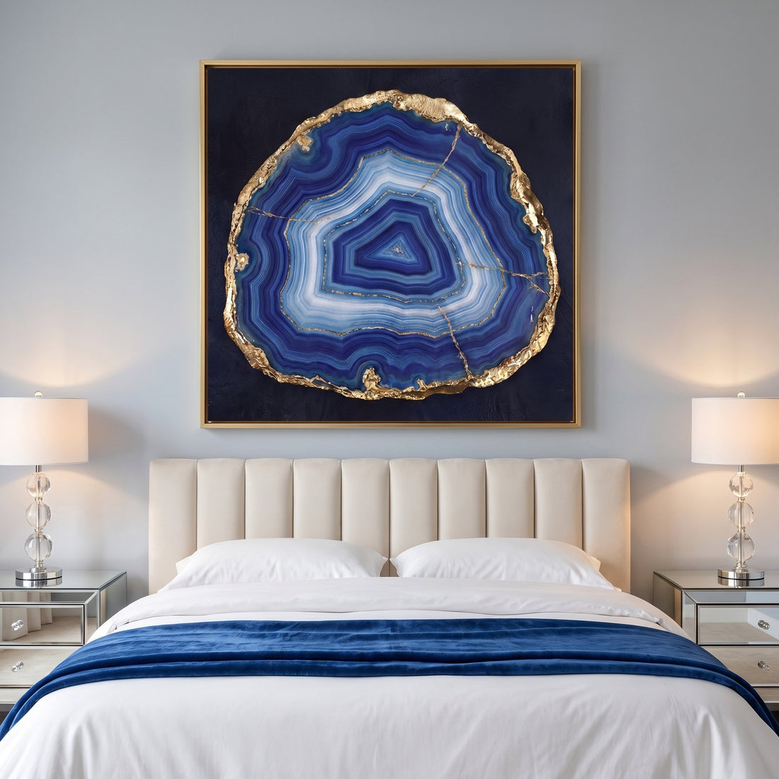 Lapis agate wall art above a cream headboard in a dove grey bedroom
