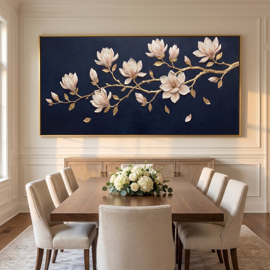 Panoramic magnolia canvas above a sideboard in a warm white dining room