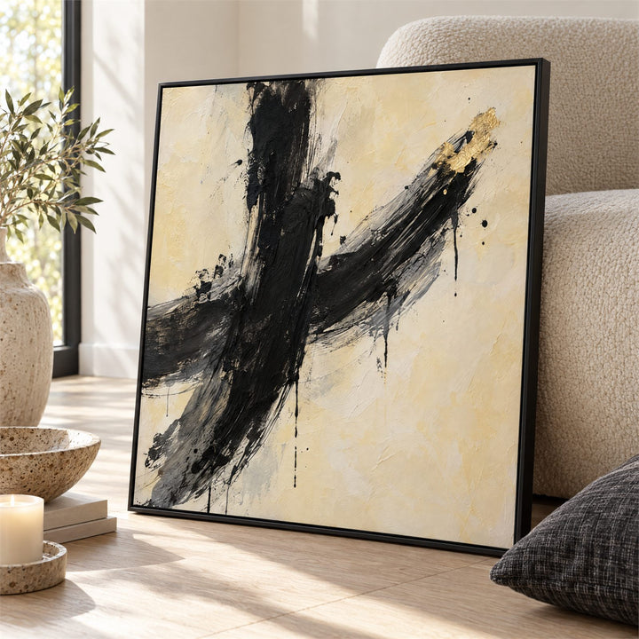 Close view of the charcoal brushstroke showing drips, spatter and the gold leaf accent