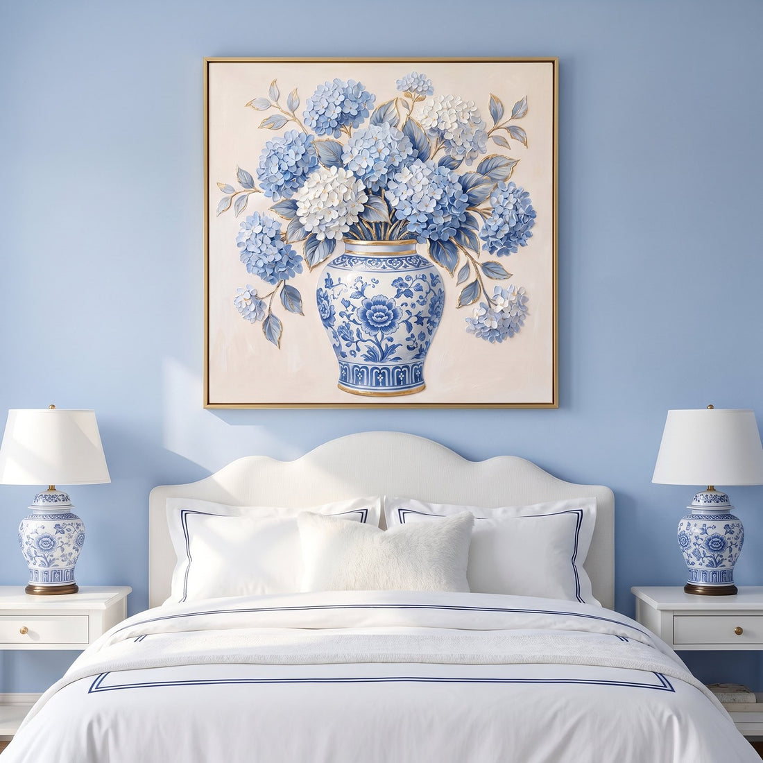 Blue and white floral wall art above a scalloped headboard in a cornflower bedroom