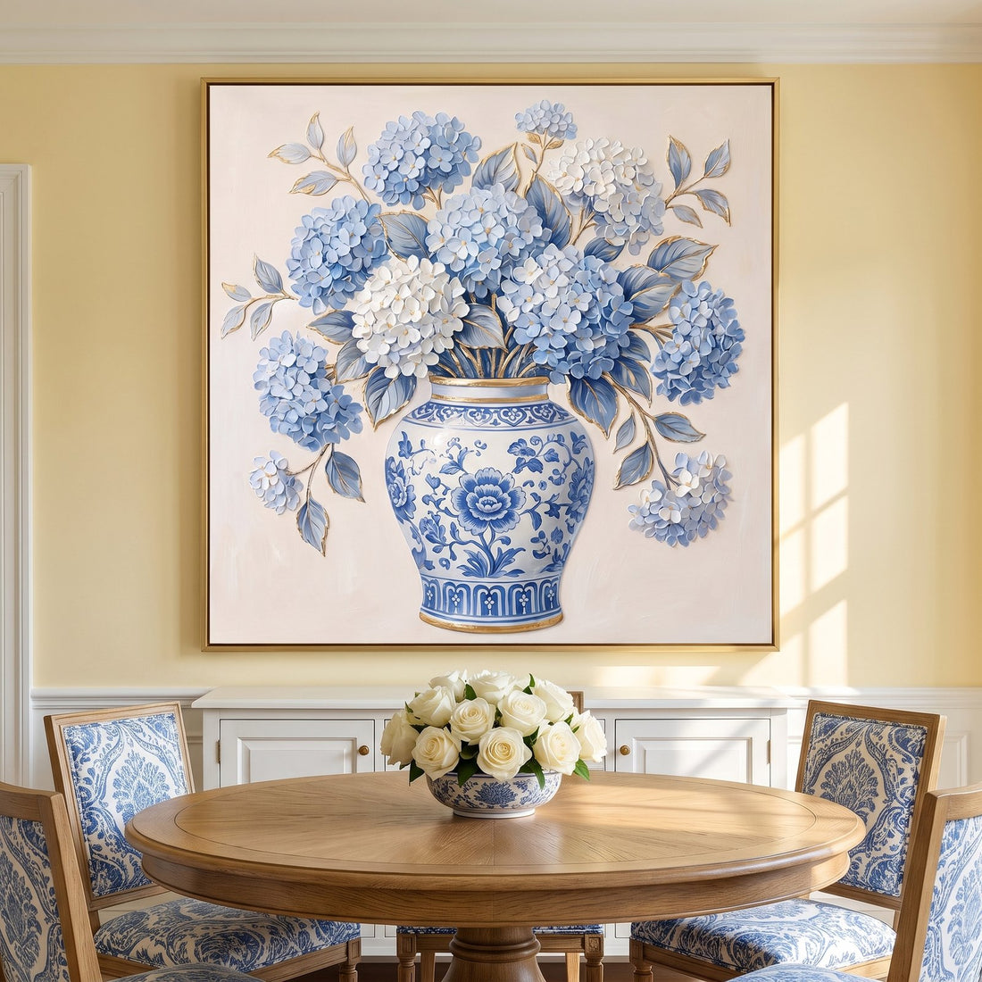 Ginger jar hydrangea canvas above a white sideboard in a butter yellow dining room
