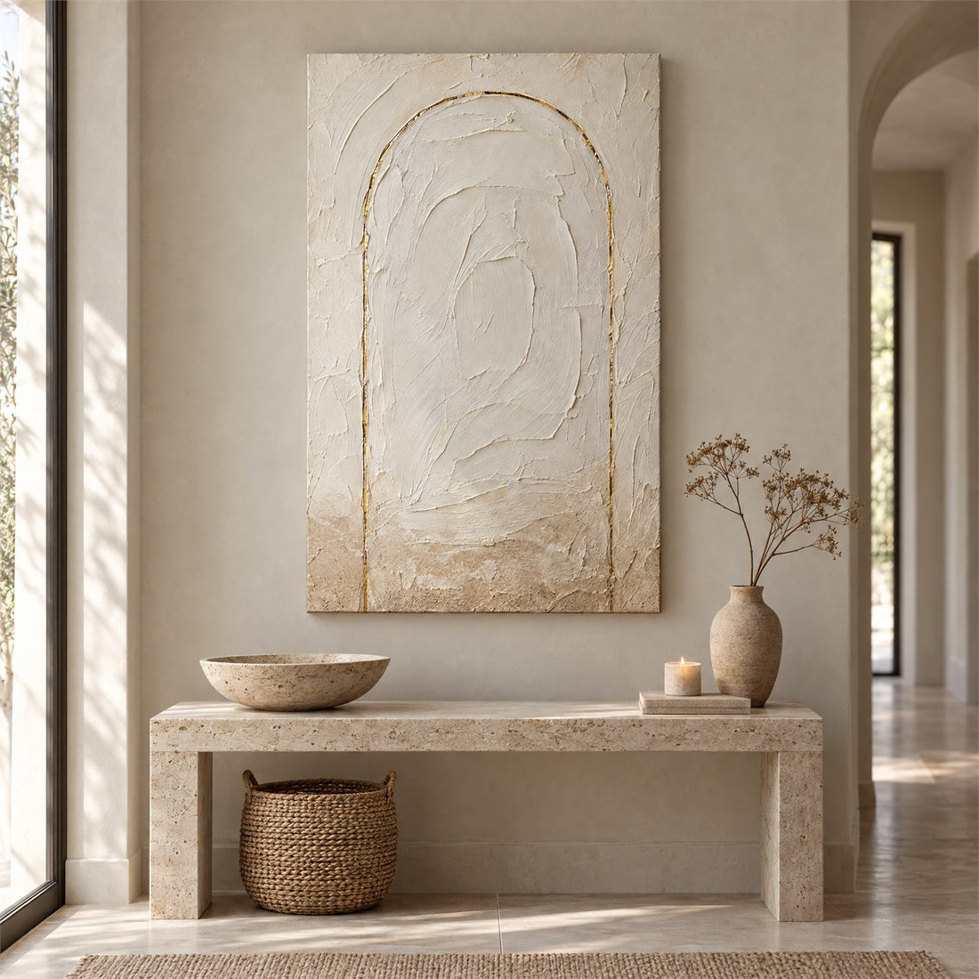 Tall plaster arch canvas above a console table in an entryway