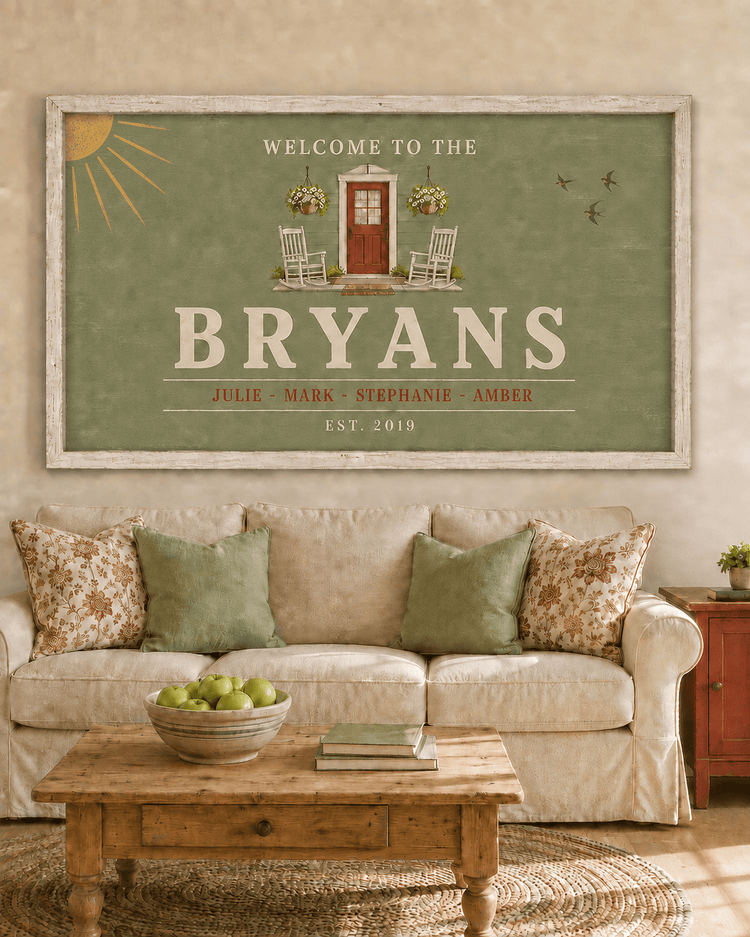 Personalized farmhouse welcome sign canvas in sage green with family surname, first names and established date, hung above a sofa