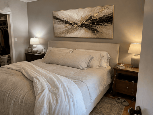 Mike W. at home with his Gilded Burst canvas hanging above the bed