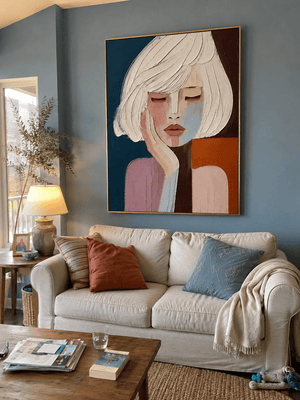 Paul and Sylvia at home with their Quiet Reverie canvas hanging above the sofa