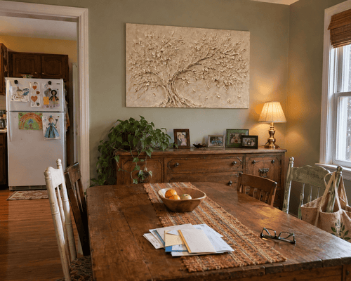 Carlos M. at home with his Ivory Canopy canvas hanging in the dining room
