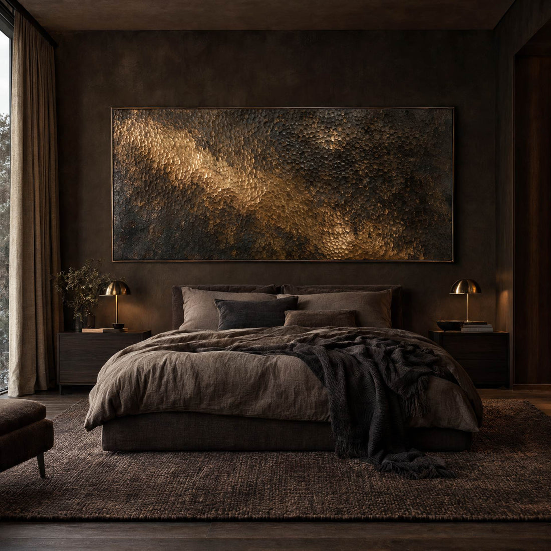 Hammered brass relief canvas above a bed in a warm bedroom