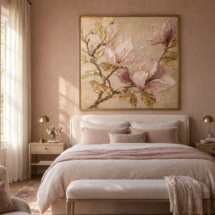 Blush magnolia and gold canvas above a bed in a pink bedroom