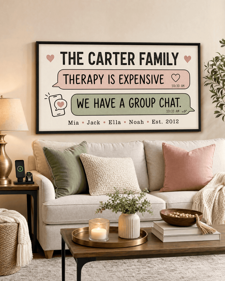 Personalized family name canvas with text bubbles reading therapy is expensive, we have a group chat, hung above a cream sofa