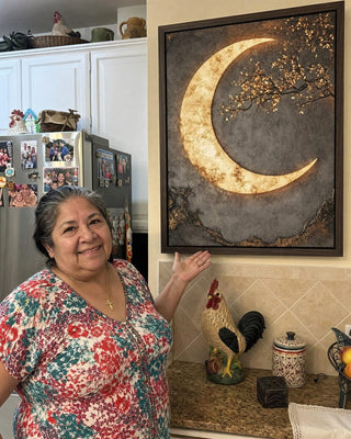 Customer couple in their hallway with the Luxury Crescent Moon canvas above the console table