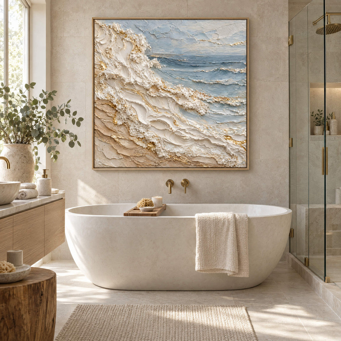 Coastal wave canvas above a freestanding bath in a stone bathroom