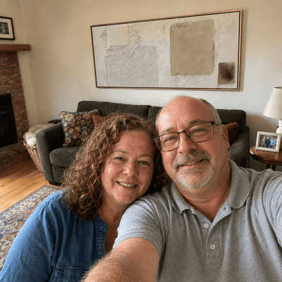 Lisa and Robert M. at home with their Minimalist Plaster canvas above the sofa